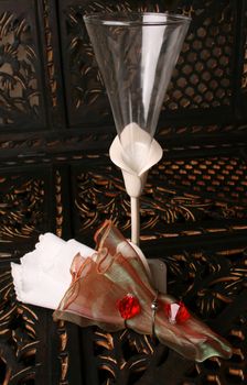 Decorated long stem glasses with a White and organza napkin