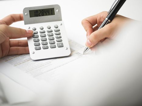 Market Analyze - pen and calculator on papers