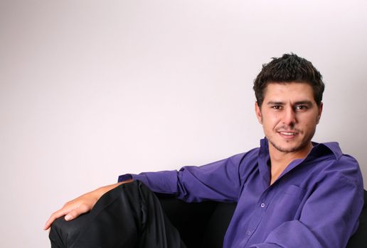 Male model in studio against white wall
