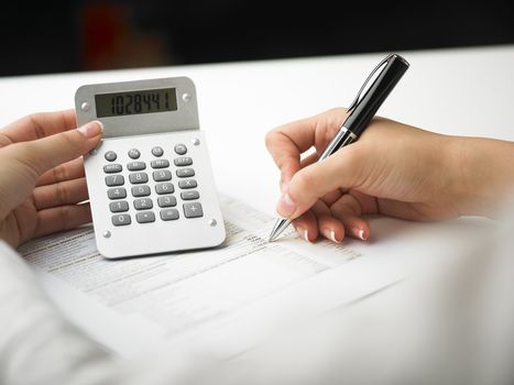 Market Analyze - pen and calculator on papers