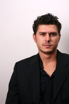 Male model in studio against white wall