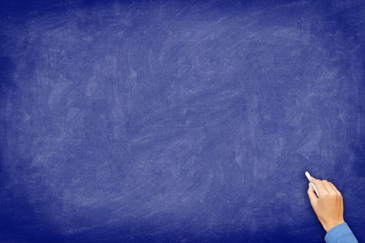 Chalkboard. blue blackboard with hand writing with chalk. Board texture background with used feel.