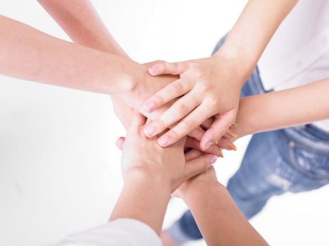 Business team join hands on white background