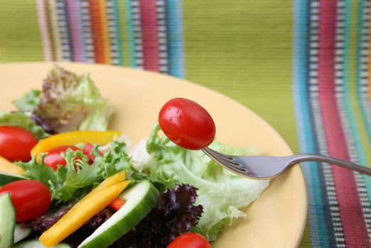 Fresh colorful salad with cherrie tamatoes and cucumber