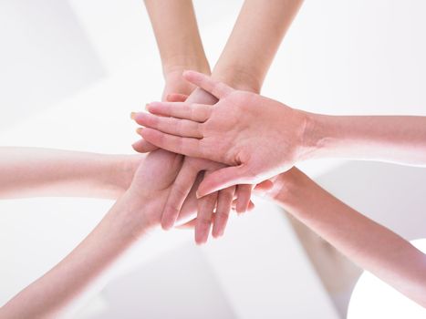 Business team join hands on white background