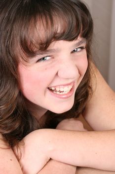 Beautiful brunette female teenager with intense blue eyes