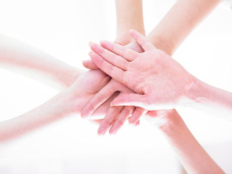 Business team join hands on white background