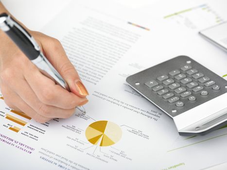 Market Analyze - pen and calculator on papers