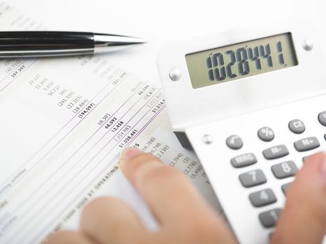 Market Analyze - pen and calculator on papers