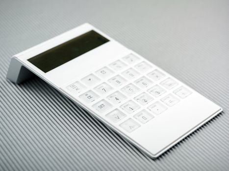 White Calculator On Office Desk