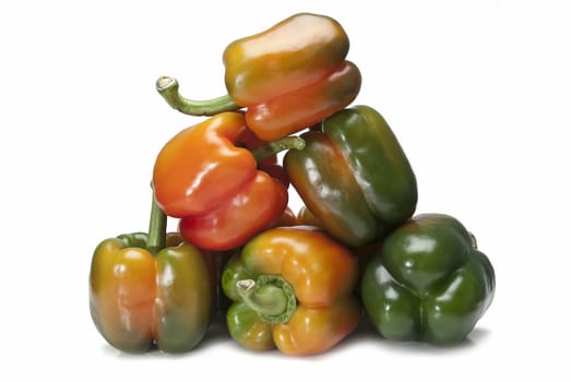 Red and green peppers isolated over a white background.