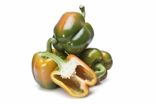 Red and green peppers isolated over a white background.