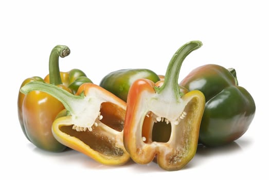 Red and green peppers isolated over a white background.