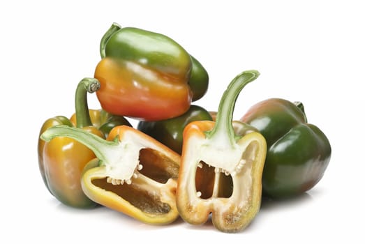 Red and green peppers isolated over a white background.