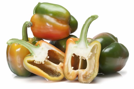 Red and green peppers isolated over a white background.