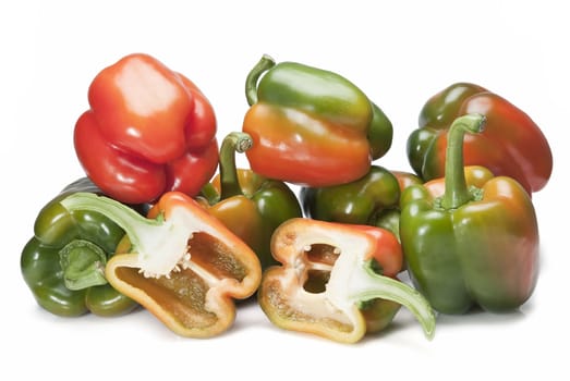 Red and green peppers isolated over a white background.