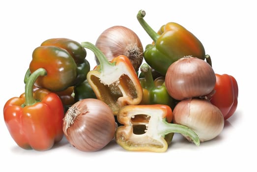 Peppers and onions isolated over a white background.