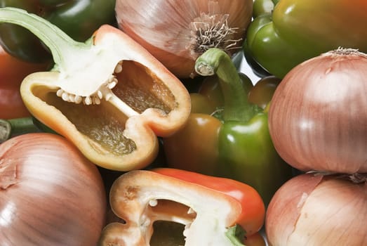 Peppers and onions isolated over a white background.