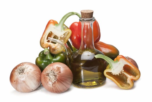 Olive oil and some vegetables like tomatoes, peppers and onions to make gazpacho isolated over a white background.