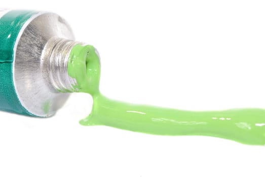 green acrylic paint tube isolated on white background 