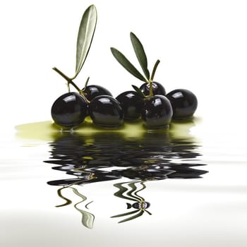 Black olives covered in olive oil and reflected on water.