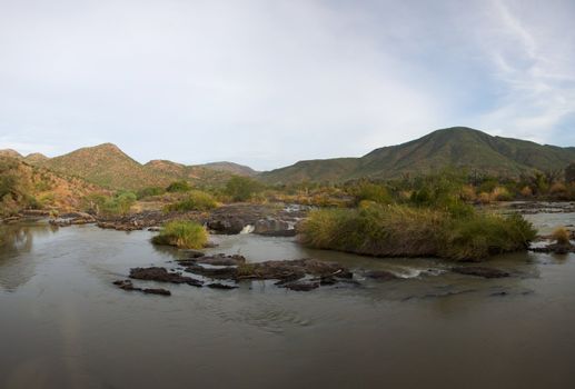 The Epupa Falls lie on the Kunene River, on the border of Angola and Namibia