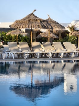 the pool and lounge chairs