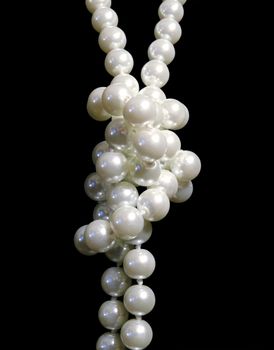 White pearls on black background