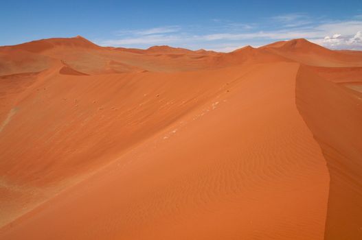 Dune sea of the Namib desert during a hot day
