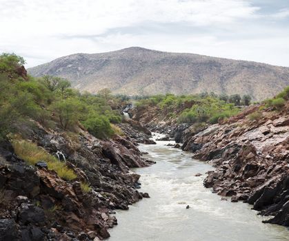 The Epupa Falls lie on the Kunene River, on the border of Angola and Namibia