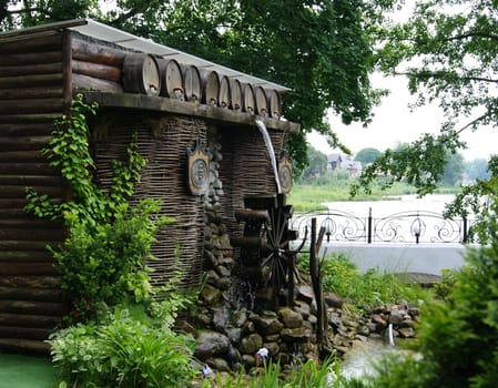 The decorative watermill is used as an interior. Modern construction