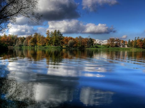 Autumn landscape with trees and reflection in lake