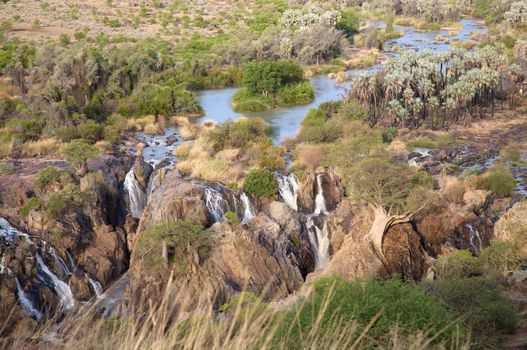 The Epupa Falls lie on the Kunene River, on the border of Angola and Namibia