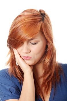 Young woman in pain is having toothache isolated on white