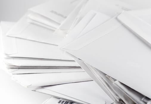 White mail envelopes on white background close up photo