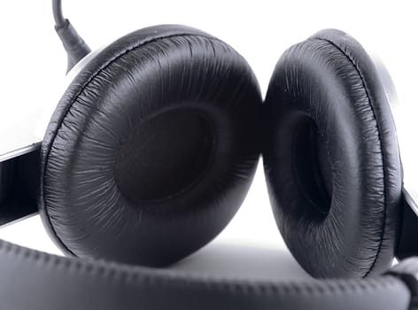 Black headphones over white background