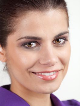 Portrait of smiling pretty young brunette woman
