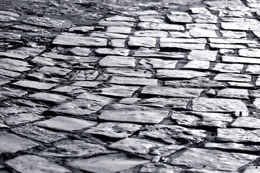 Black and white photo of a old small street in a small mediteranean town in Croatia. 