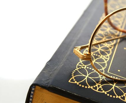 edge of a book and a pair of glasses