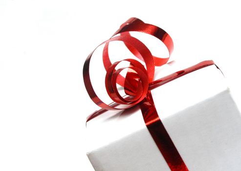 a present wrapped with a red bow