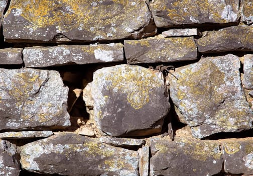 Old grunge stone wall close up photo