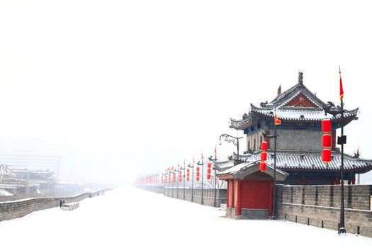 The south rampart gate of ancient Xi'an is covered by the first snow in 2011.