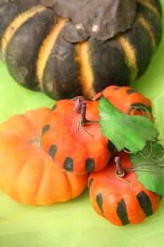 Dusty Old Halloween pumpkins on a green background