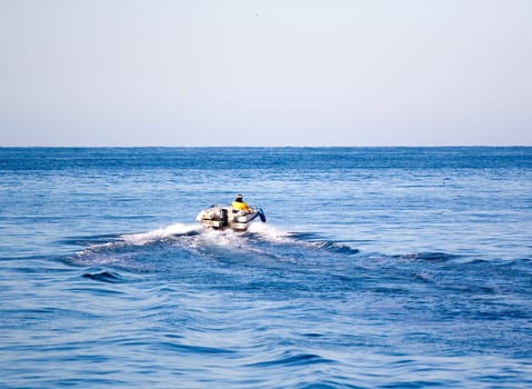 Man in the motor boat speeding 