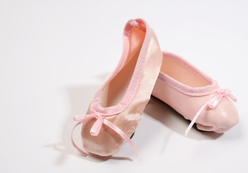One Leather and one satin ballet shoe