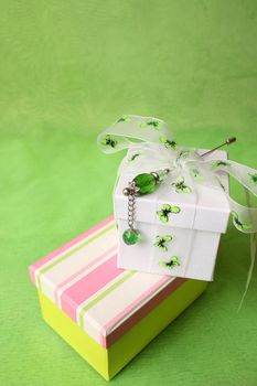 White and striped gift box with ribbons