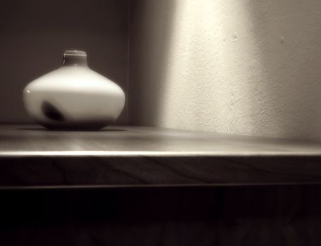 Vase on the wooden table in modern interior - Soft focus black and white toned  photo