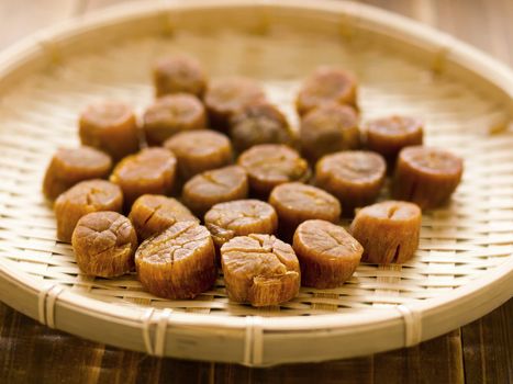 close up of a basket of dried scallops