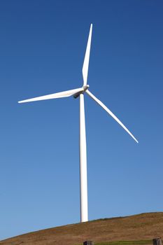 Wind turbines on a hill in rural Washington state.