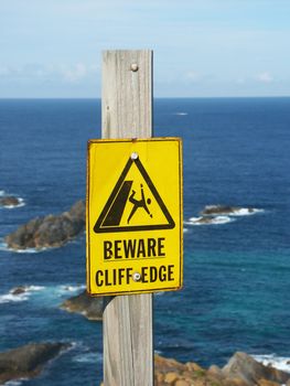 Beware of Cliff Edge Sign at Booti Booti National Park of Australia.